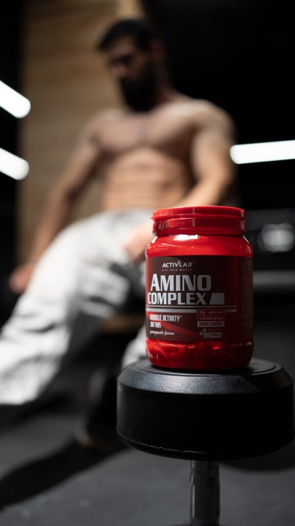 Red Box of Creatine on Dumbbell