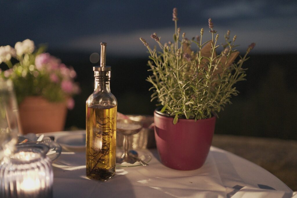 clear glass bottle beside plant