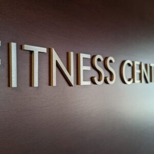 a sign that says fitness center on a wall